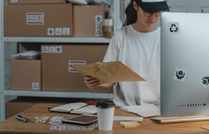 Chinese e commerce warehouse with shelves of neatly stacked custom printed shipping boxes in different sizes showing efficient space usage