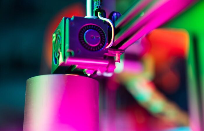 Modern digital printing press in action producing vibrant custom boxes with variable data personalization high resolution close up showing inkjet heads and colorful output