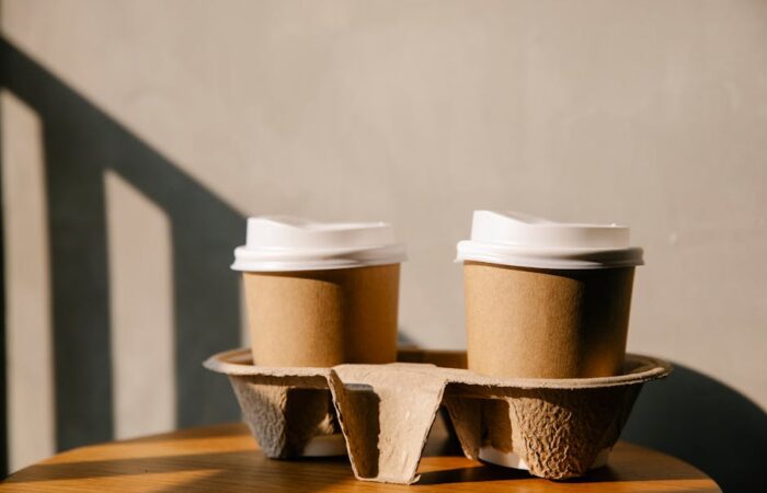 eco friendly kraft paper boxes on wooden table sustainable packaging