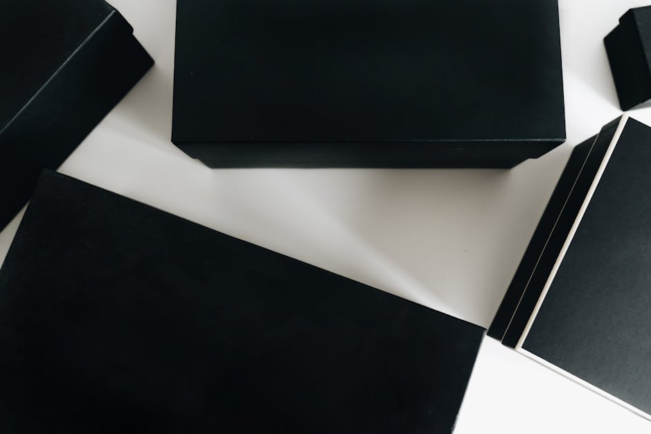 Step by step visual of custom packaging production process from design software to finished branded boxes on an assembly line highlighting printing and die cutting Step by step visual of custom packaging production process from design software to finished branded boxes on an assembly line highlighting printing and die cutting