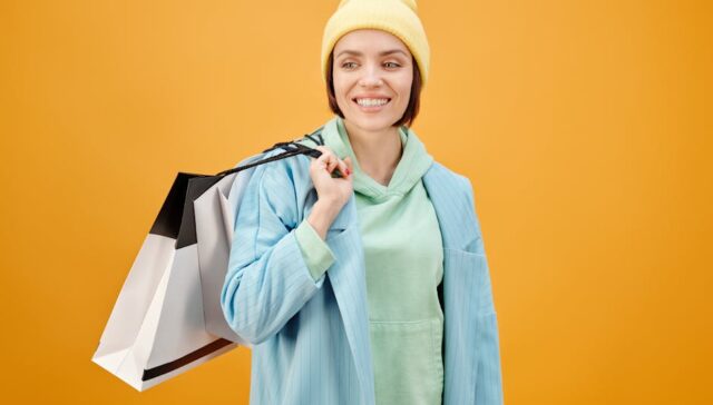 Vibrant cityscape at dusk with diverse urban consumers holding custom branded paper bags and boxes overlayed with icons representing e commerce sustainability and personalization