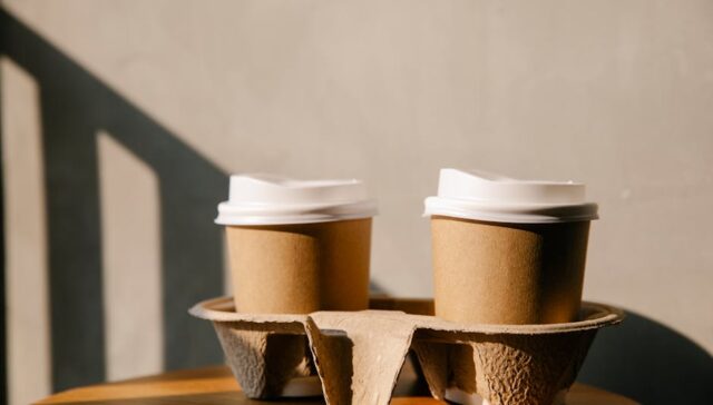 eco friendly kraft paper boxes on wooden table sustainable packaging